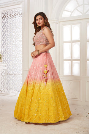 Buy beautiful powder pink and yellow embroidered lehenga online in USA with dupatta. Dazzle at weddings and parties in exquisite Indian designerwear dresses, designer lehengas, Anarkali suits, gowns, palazzo suits, sharara suits from Pure Elegance Indian fashion store in USA.-left