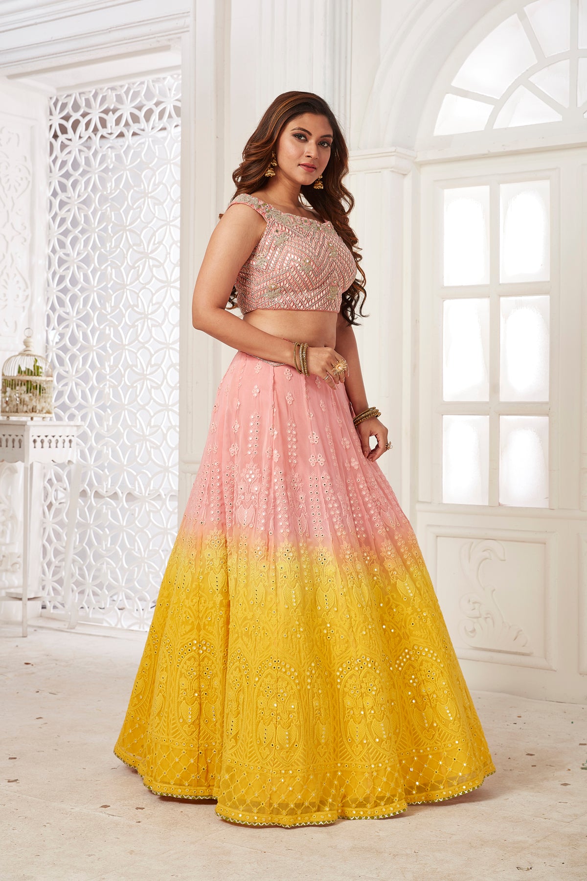 Buy beautiful powder pink and yellow embroidered lehenga online in USA with dupatta. Dazzle at weddings and parties in exquisite Indian designerwear dresses, designer lehengas, Anarkali suits, gowns, palazzo suits, sharara suits from Pure Elegance Indian fashion store in USA.-right