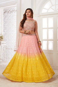 Buy beautiful powder pink and yellow embroidered lehenga online in USA with dupatta. Dazzle at weddings and parties in exquisite Indian designerwear dresses, designer lehengas, Anarkali suits, gowns, palazzo suits, sharara suits from Pure Elegance Indian fashion store in USA.-full view