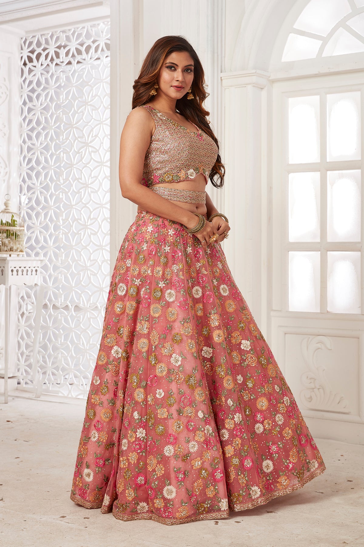Buy stunning pink embroidered net lehenga online in USA with dupatta. Dazzle at weddings and parties in exquisite Indian designerwear dresses, designer lehengas, Anarkali suits, gowns, palazzo suits, sharara suits from Pure Elegance Indian fashion store in USA.-right