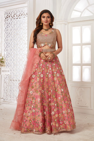 Buy stunning pink embroidered net lehenga online in USA with dupatta. Dazzle at weddings and parties in exquisite Indian designerwear dresses, designer lehengas, Anarkali suits, gowns, palazzo suits, sharara suits from Pure Elegance Indian fashion store in USA.-front