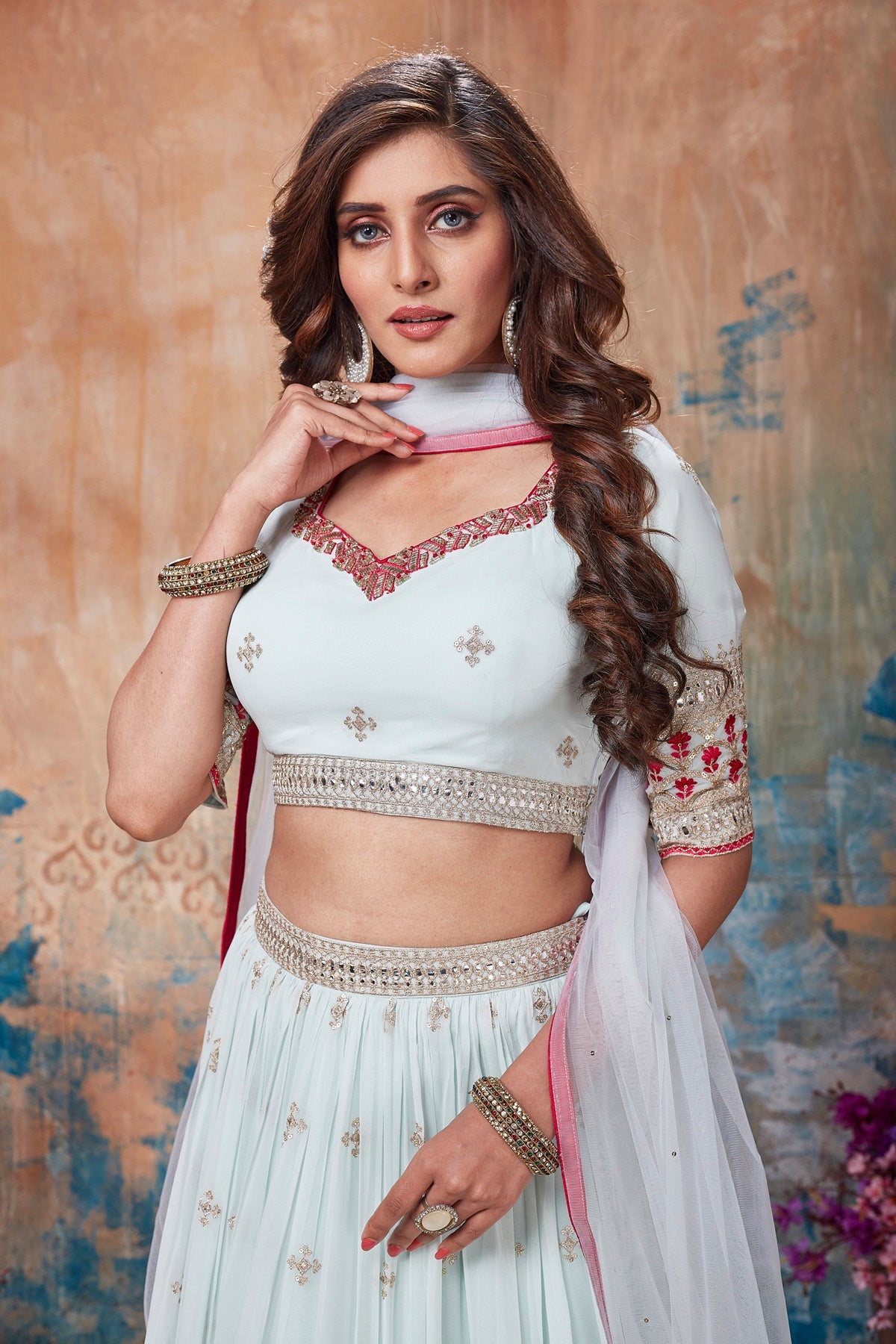 Shop stunning white embroidered lehenga online in USA with dupatta. Get set for weddings and festive occasions in exclusive designer Anarkali suits, wedding gown, salwar suits, gharara suits, Indowestern dresses from Pure Elegance Indian fashion store in USA.-closeup