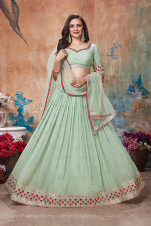 Shop beautiful pista green embroidered lehenga online in USA with dupatta. Get set for weddings and festive occasions in exclusive designer Anarkali suits, wedding gown, salwar suits, gharara suits, Indowestern dresses from Pure Elegance Indian fashion store in USA.-front