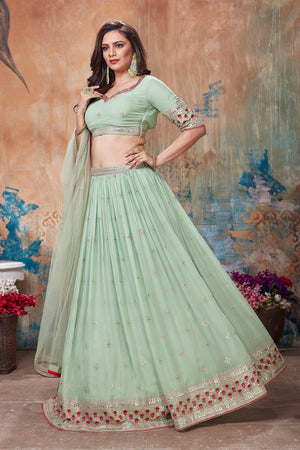 Shop beautiful pista green embroidered lehenga online in USA with dupatta. Get set for weddings and festive occasions in exclusive designer Anarkali suits, wedding gown, salwar suits, gharara suits, Indowestern dresses from Pure Elegance Indian fashion store in USA.-right