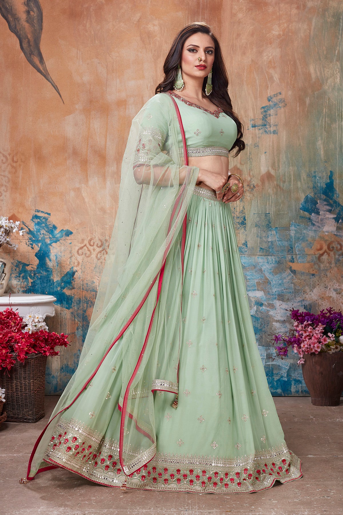 Shop beautiful pista green embroidered lehenga online in USA with dupatta. Get set for weddings and festive occasions in exclusive designer Anarkali suits, wedding gown, salwar suits, gharara suits, Indowestern dresses from Pure Elegance Indian fashion store in USA.-side