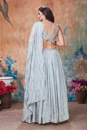 Buy gorgeous light grey embroidered designer lehenga online in USA with dupatta. Get set for weddings and festive occasions in exclusive designer Anarkali suits, wedding gown, salwar suits, gharara suits, Indowestern dresses from Pure Elegance Indian fashion store in USA.-back