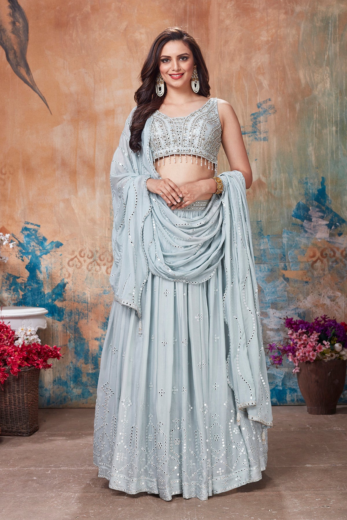 Buy gorgeous light grey embroidered designer lehenga online in USA with dupatta. Get set for weddings and festive occasions in exclusive designer Anarkali suits, wedding gown, salwar suits, gharara suits, Indowestern dresses from Pure Elegance Indian fashion store in USA.-full view