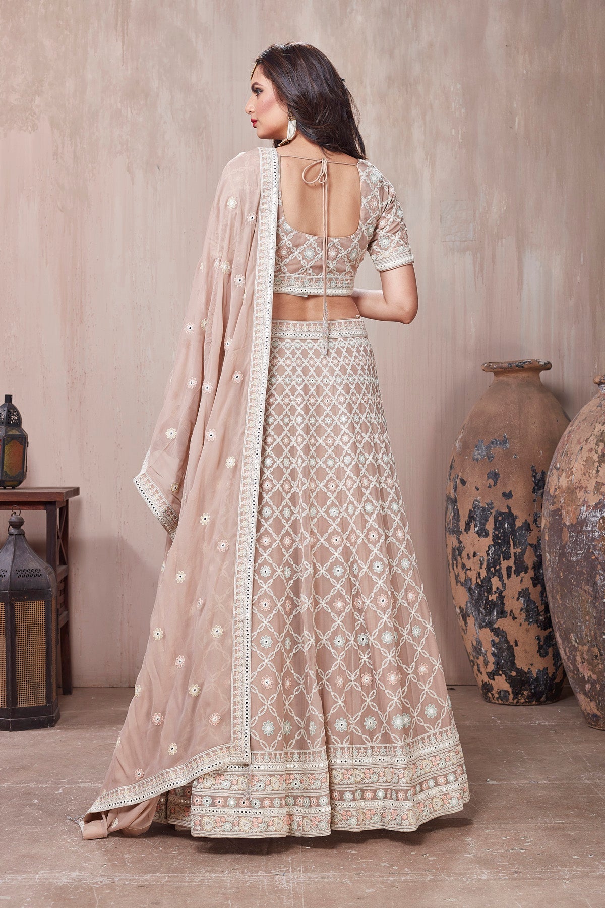 Buy beautiful beige embroidered designer lehenga online in USA with dupatta. Get set for weddings and festive occasions in exclusive designer Anarkali suits, wedding gown, salwar suits, gharara suits, Indowestern dresses from Pure Elegance Indian fashion store in USA.-back