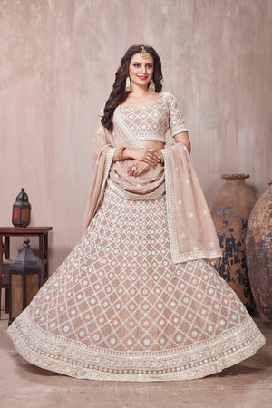 Buy beautiful beige embroidered designer lehenga online in USA with dupatta. Get set for weddings and festive occasions in exclusive designer Anarkali suits, wedding gown, salwar suits, gharara suits, Indowestern dresses from Pure Elegance Indian fashion store in USA.-front