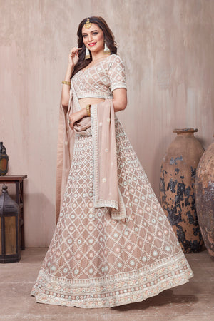 Buy beautiful beige embroidered designer lehenga online in USA with dupatta. Get set for weddings and festive occasions in exclusive designer Anarkali suits, wedding gown, salwar suits, gharara suits, Indowestern dresses from Pure Elegance Indian fashion store in USA.-right
