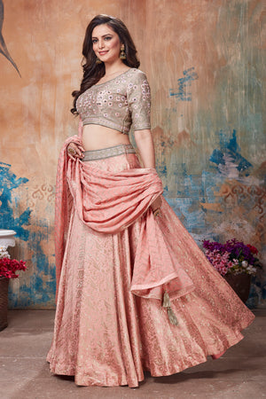 Buy stunning peach and beige embroidered designer lehenga online in USA with dupatta. Get set for weddings and festive occasions in exclusive designer Anarkali suits, wedding gown, salwar suits, gharara suits, Indowestern dresses from Pure Elegance Indian fashion store in USA.-left
