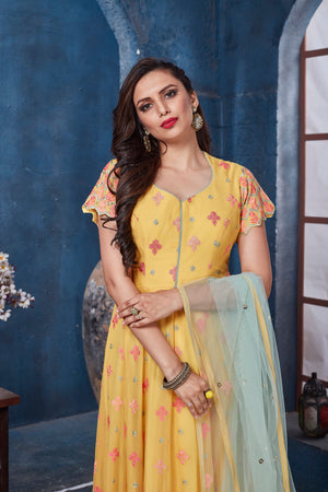 Buy gorgeous yellow embroidered floorlength Anarkali online in USA with dupatta. Get set for weddings and festive occasions in exclusive designer Anarkali suits, wedding gown, salwar suits, gharara suits, Indowestern dresses from Pure Elegance Indian fashion store in USA.-closeup