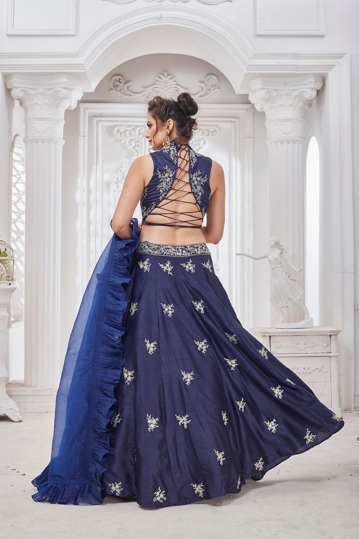 Shop gorgeous blue embroidered designer lehenga online in USA with ruffle dupatta. Get set for weddings and festive occasions in exclusive designer Anarkali suits, wedding gown, salwar suits, gharara suits, Indowestern dresses from Pure Elegance Indian fashion store in USA.-back