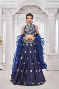 Shop gorgeous blue embroidered designer lehenga online in USA with ruffle dupatta. Get set for weddings and festive occasions in exclusive designer Anarkali suits, wedding gown, salwar suits, gharara suits, Indowestern dresses from Pure Elegance Indian fashion store in USA.-full view