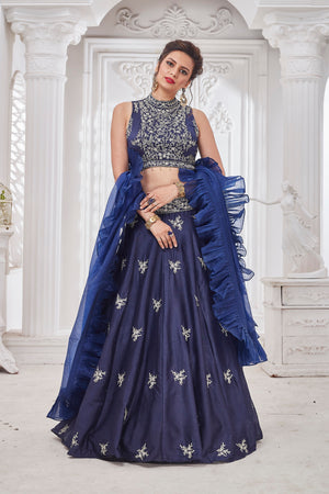 Shop gorgeous blue embroidered designer lehenga online in USA with ruffle dupatta. Get set for weddings and festive occasions in exclusive designer Anarkali suits, wedding gown, salwar suits, gharara suits, Indowestern dresses from Pure Elegance Indian fashion store in USA.-ruffle dupatta