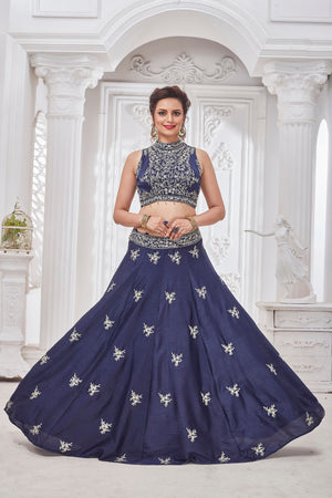Shop gorgeous blue embroidered designer lehenga online in USA with ruffle dupatta. Get set for weddings and festive occasions in exclusive designer Anarkali suits, wedding gown, salwar suits, gharara suits, Indowestern dresses from Pure Elegance Indian fashion store in USA.-front