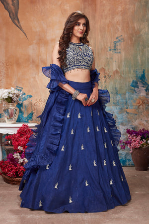 Buy gorgeous blue designer lehenga online in USA with ruffle dupatta. Get set for weddings and festive occasions in exclusive designer Anarkali suits, wedding gown, salwar suits, gharara suits, Indowestern dresses from Pure Elegance Indian fashion store in USA.-left