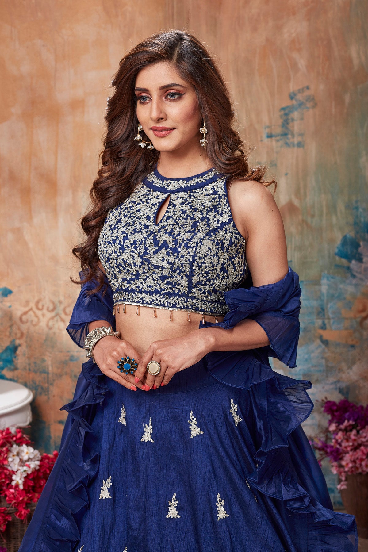 Buy gorgeous blue designer lehenga online in USA with ruffle dupatta. Get set for weddings and festive occasions in exclusive designer Anarkali suits, wedding gown, salwar suits, gharara suits, Indowestern dresses from Pure Elegance Indian fashion store in USA.-closeup