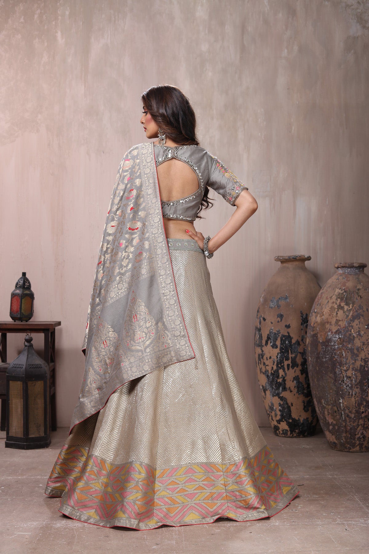 Buy beautiful grey embroidered lehenga online in USA with dupatta. Get set for weddings and festive occasions in exclusive designer Anarkali suits, wedding gown, salwar suits, gharara suits, Indowestern dresses from Pure Elegance Indian fashion store in USA.-back