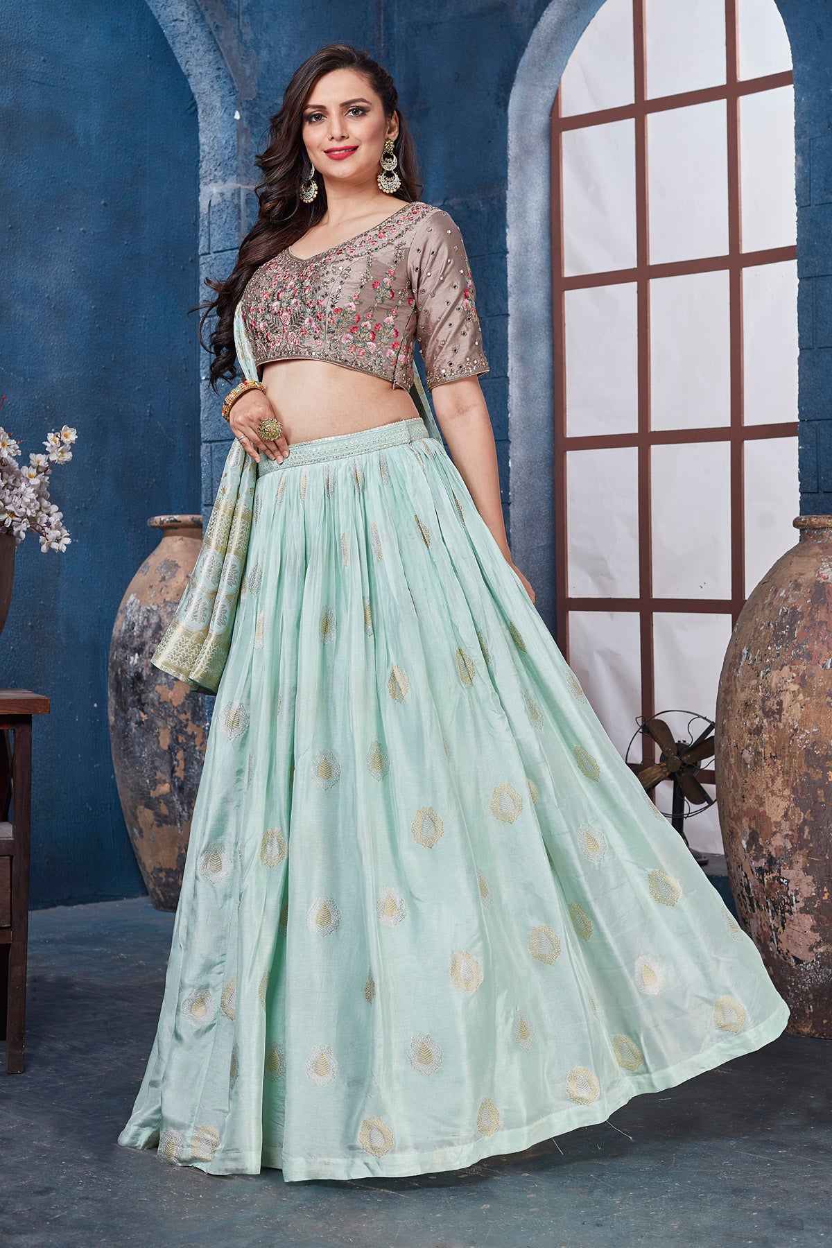 Shop beige and mint green embroidered designer lehenga online in USA. Get set for weddings and festive occasions in exclusive designer Anarkali suits, wedding gown, salwar suits, gharara suits, Indowestern dresses from Pure Elegance Indian fashion store in USA.-right