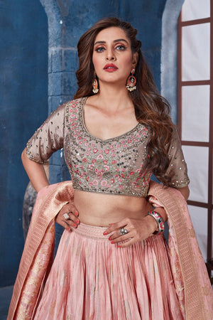 Buy gorgeous peach and beige embroidered designer lehenga online in USA with dupatta. Get set for weddings and festive occasions in exclusive designer Anarkali suits, wedding gown, salwar suits, gharara suits, Indowestern dresses from Pure Elegance Indian fashion store in USA.-closeup