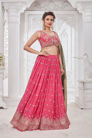 Buy beautiful pink embroidered lehenga online in USA with green dupatta. Get set for weddings and festive occasions in exclusive designer Anarkali suits, wedding gown, salwar suits, gharara suits, Indowestern dresses from Pure Elegance Indian fashion store in USA.-left