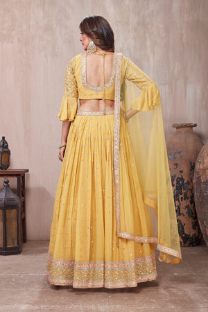 Buy stunning yellow embroidered designer lehenga online in USA with dupatta. Get set for weddings and festive occasions in exclusive designer Anarkali suits, wedding gown, salwar suits, gharara suits, Indowestern dresses from Pure Elegance Indian fashion store in USA.-back
