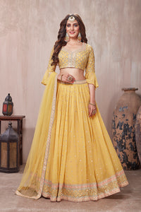 Buy stunning yellow embroidered designer lehenga online in USA with dupatta. Get set for weddings and festive occasions in exclusive designer Anarkali suits, wedding gown, salwar suits, gharara suits, Indowestern dresses from Pure Elegance Indian fashion store in USA.-full view