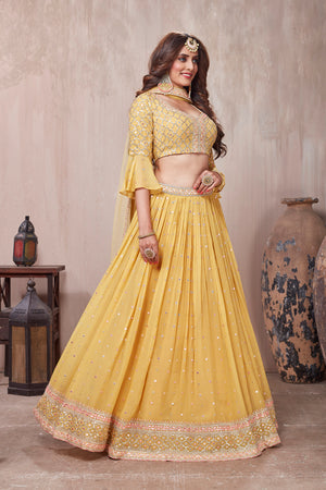Buy stunning yellow embroidered designer lehenga online in USA with dupatta. Get set for weddings and festive occasions in exclusive designer Anarkali suits, wedding gown, salwar suits, gharara suits, Indowestern dresses from Pure Elegance Indian fashion store in USA.-right
