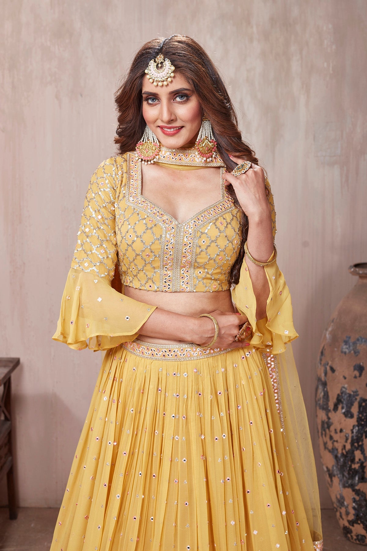 Buy stunning yellow embroidered designer lehenga online in USA with dupatta. Get set for weddings and festive occasions in exclusive designer Anarkali suits, wedding gown, salwar suits, gharara suits, Indowestern dresses from Pure Elegance Indian fashion store in USA.-closeup