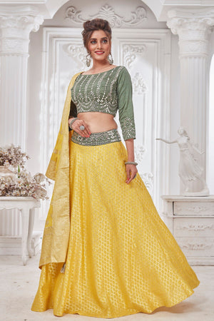 Buy beautiful yellow and green embroidered designer lehenga online in USA with dupatta. Get set for weddings and festive occasions in exclusive designer Anarkali suits, wedding gown, salwar suits, gharara suits, Indowestern dresses from Pure Elegance Indian fashion store in USA.-left