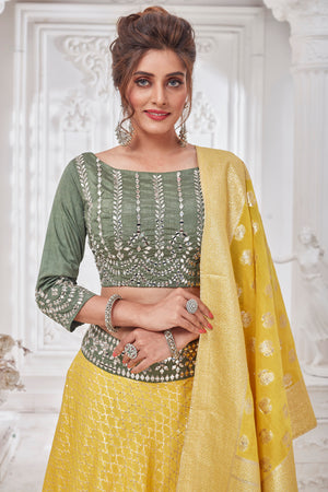 Buy beautiful yellow and green embroidered designer lehenga online in USA with dupatta. Get set for weddings and festive occasions in exclusive designer Anarkali suits, wedding gown, salwar suits, gharara suits, Indowestern dresses from Pure Elegance Indian fashion store in USA.-closeup