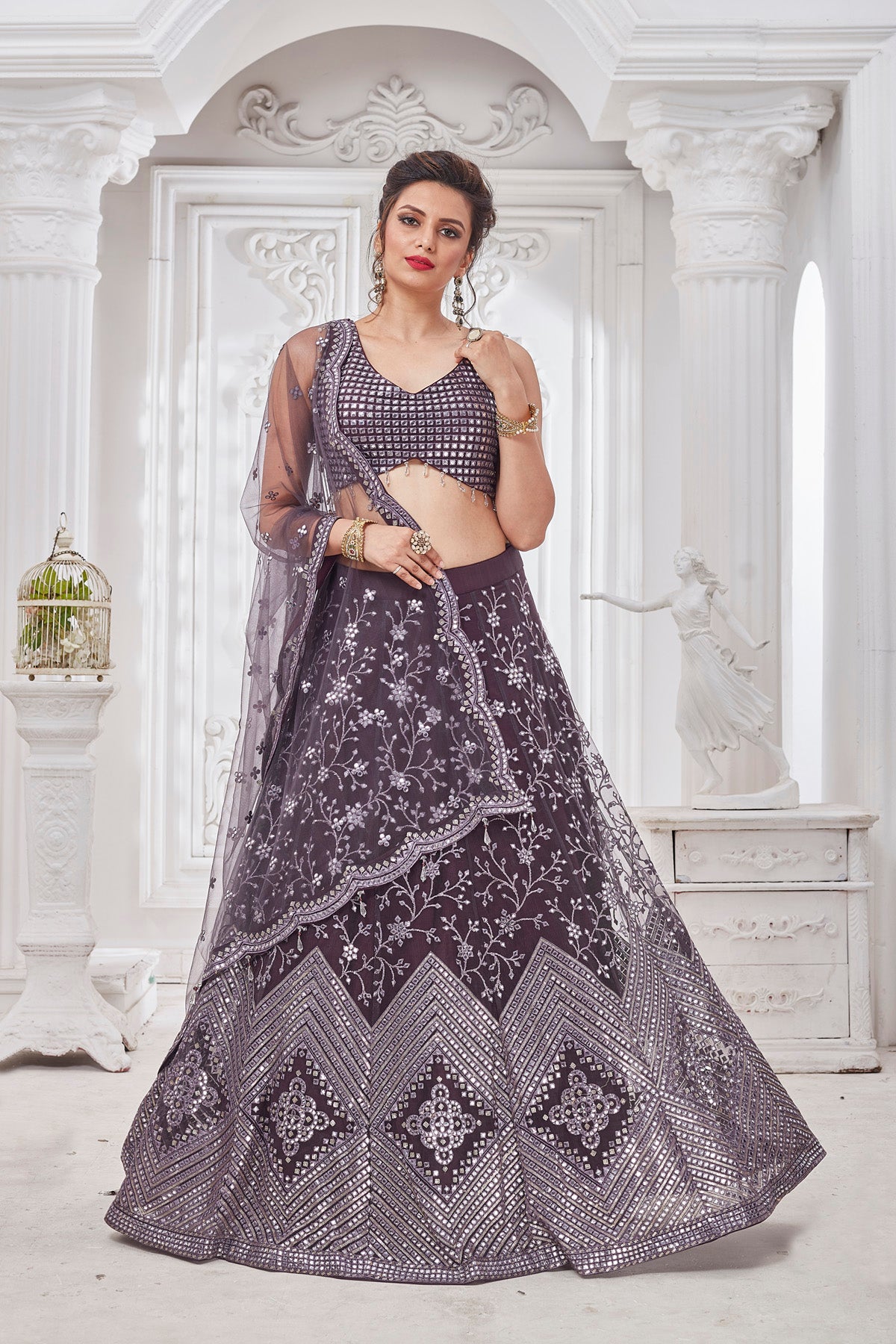 Shop beautiful dark grey embroidered designer net lehenga online in USA with dupatta. Get set for weddings and festive occasions in exclusive designer Anarkali suits, wedding gown, salwar suits, gharara suits, Indowestern dresses from Pure Elegance Indian fashion store in USA.-front
