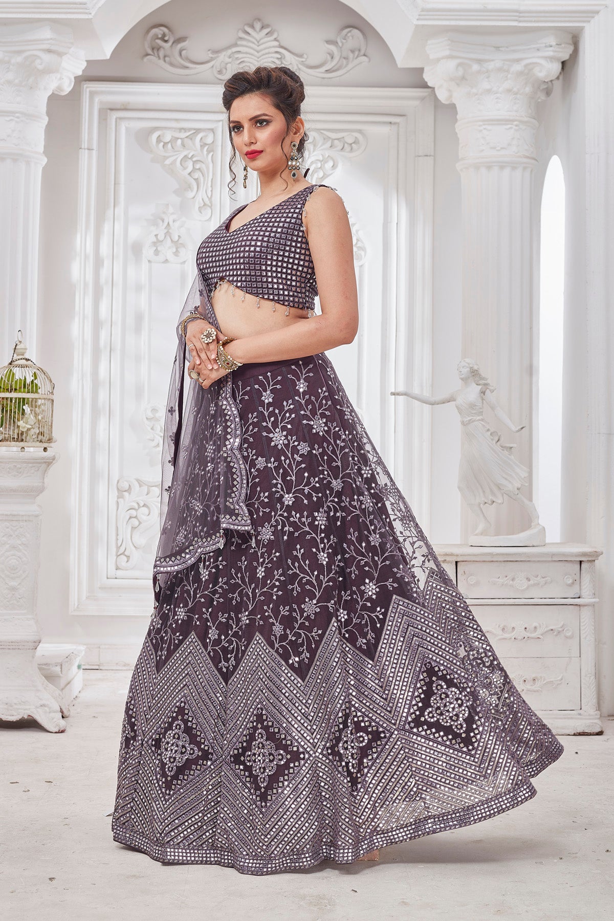 Shop beautiful dark grey embroidered designer net lehenga online in USA with dupatta. Get set for weddings and festive occasions in exclusive designer Anarkali suits, wedding gown, salwar suits, gharara suits, Indowestern dresses from Pure Elegance Indian fashion store in USA.-left