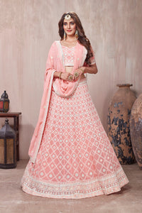Shop stunning pastel pink embroidered designer lehenga online in USA with dupatta. Get set for weddings and festive occasions in exclusive designer Anarkali suits, wedding gown, salwar suits, gharara suits, Indowestern dresses from Pure Elegance Indian fashion store in USA.-full view