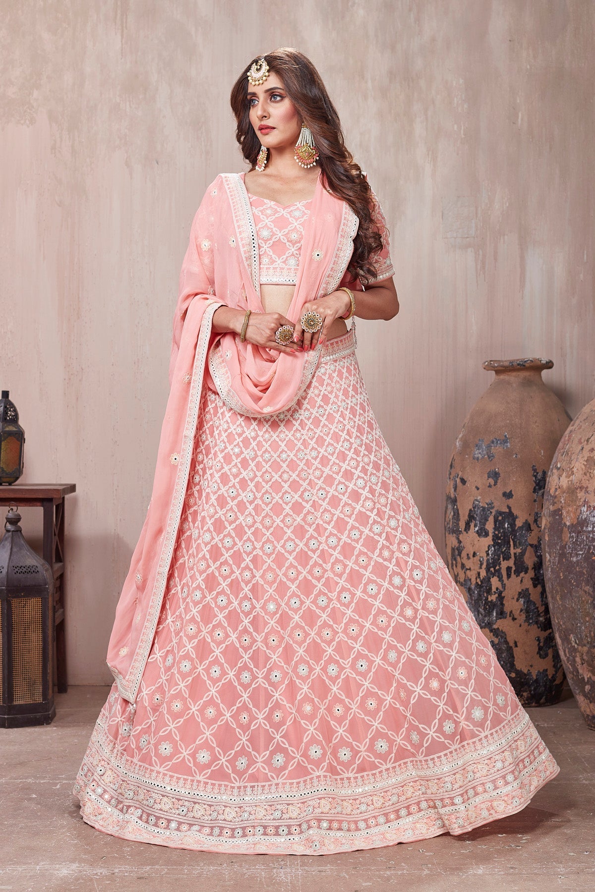 Shop stunning pastel pink embroidered designer lehenga online in USA with dupatta. Get set for weddings and festive occasions in exclusive designer Anarkali suits, wedding gown, salwar suits, gharara suits, Indowestern dresses from Pure Elegance Indian fashion store in USA.-front