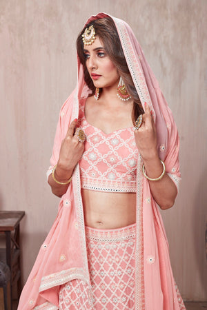 Shop stunning pastel pink embroidered designer lehenga online in USA with dupatta. Get set for weddings and festive occasions in exclusive designer Anarkali suits, wedding gown, salwar suits, gharara suits, Indowestern dresses from Pure Elegance Indian fashion store in USA.-closeup
