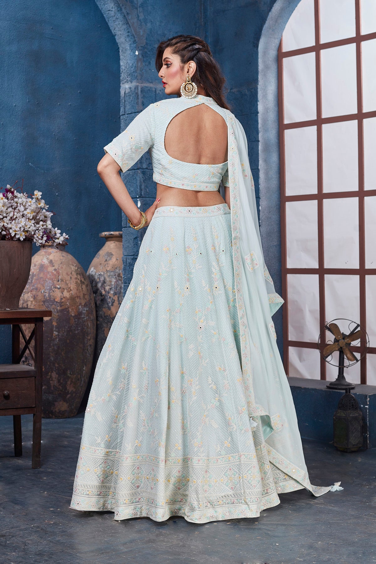 Buy gorgeous powder blue embroidered designer lehenga online in USA with dupatta. Get set for weddings and festive occasions in exclusive designer Anarkali suits, wedding gown, salwar suits, gharara suits, Indowestern dresses from Pure Elegance Indian fashion store in USA.-back