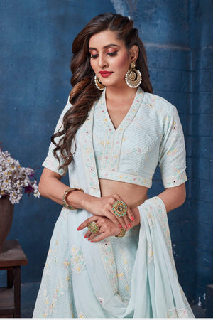 Buy gorgeous powder blue embroidered designer lehenga online in USA with dupatta. Get set for weddings and festive occasions in exclusive designer Anarkali suits, wedding gown, salwar suits, gharara suits, Indowestern dresses from Pure Elegance Indian fashion store in USA.-closeup