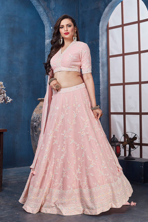 Buy stunning pastel pink embroidered designer lehenga online in USA. Get set for weddings and festive occasions in exclusive designer Anarkali suits, wedding gown, salwar suits, gharara suits, Indowestern dresses from Pure Elegance Indian fashion store in USA.-left