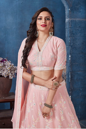 Buy stunning pastel pink embroidered designer lehenga online in USA. Get set for weddings and festive occasions in exclusive designer Anarkali suits, wedding gown, salwar suits, gharara suits, Indowestern dresses from Pure Elegance Indian fashion store in USA.-closeup