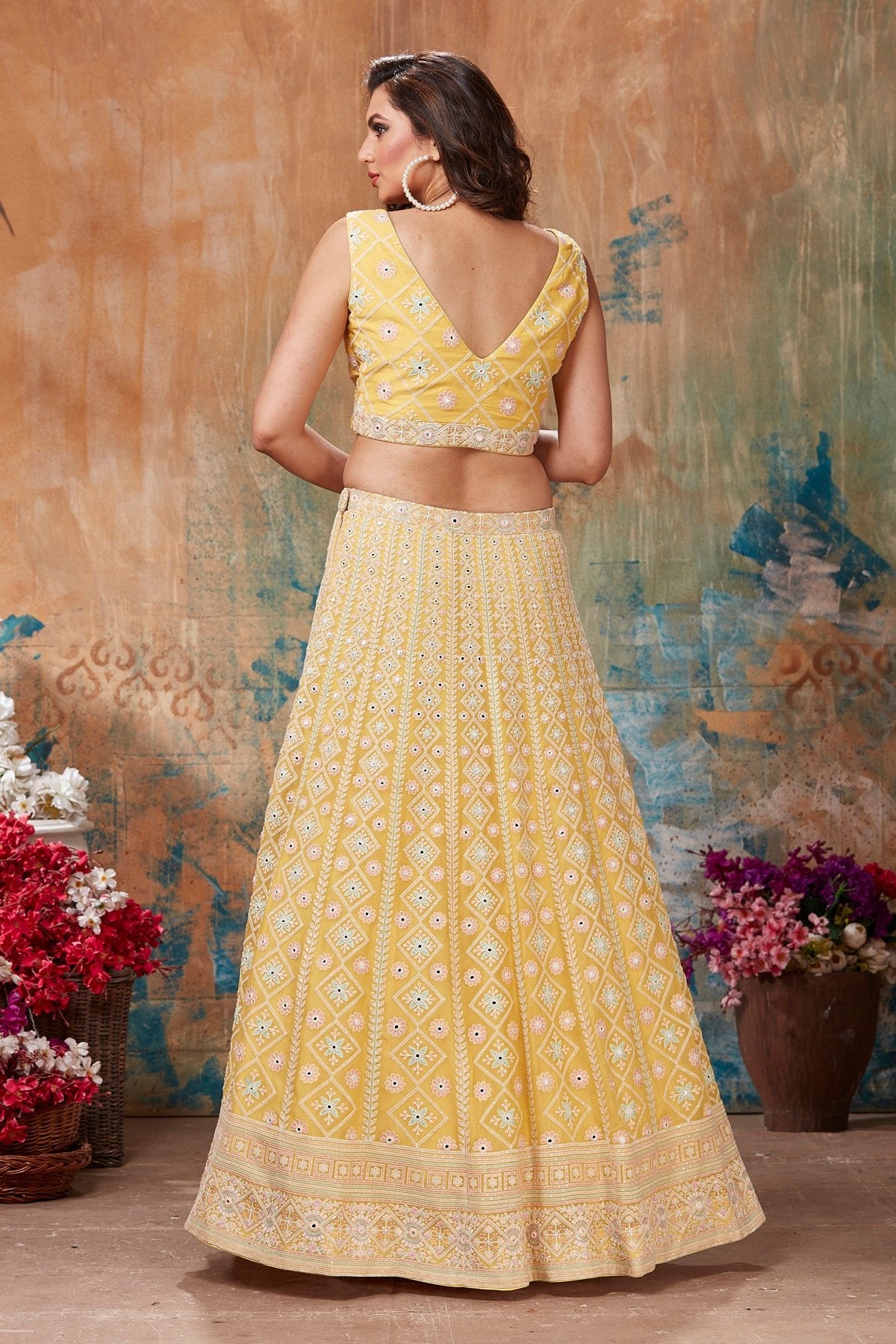 Shop gorgeous yellow embroidered designer lehenga online in USA with cape style dupatta. Get set for weddings and festive occasions in exclusive designer Anarkali suits, wedding gown, salwar suits, gharara suits, Indowestern dresses from Pure Elegance Indian fashion store in USA.-back