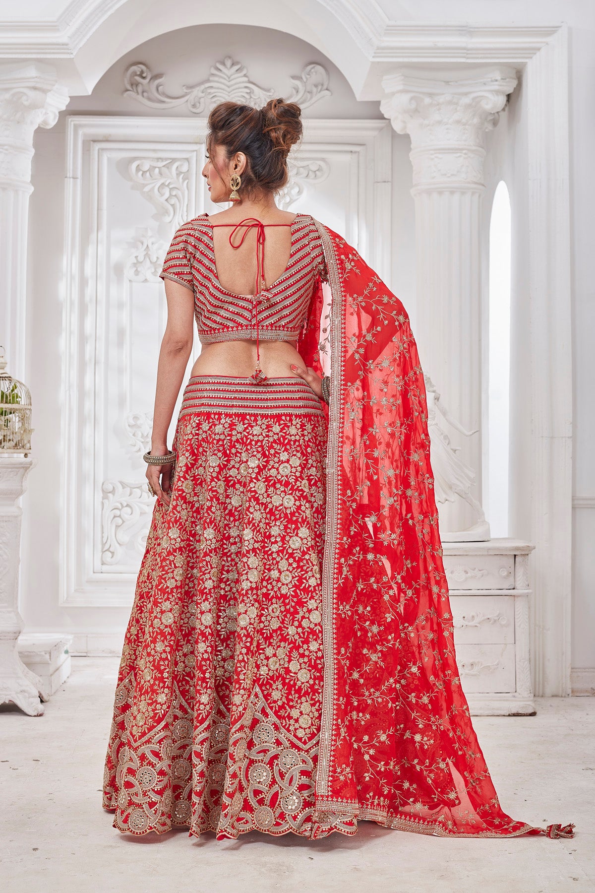 Shop stunning red embroidered bridal lehenga online in USA with dupatta. Get set for weddings and festive occasions in exclusive designer Anarkali suits, wedding gown, salwar suits, gharara suits, Indowestern dresses from Pure Elegance Indian fashion store in USA.-back