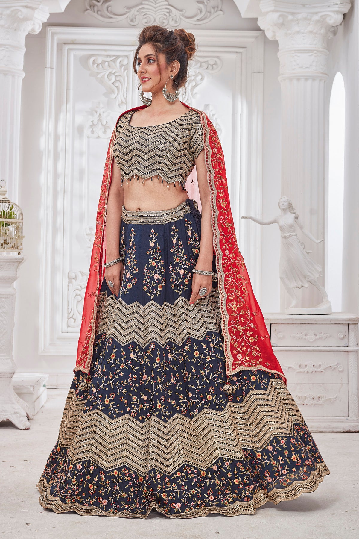 Shop gorgeous blue embroidered designer lehenga online in USA with red dupatta. Get set for weddings and festive occasions in exclusive designer Anarkali suits, wedding gown, salwar suits, gharara suits, Indowestern dresses from Pure Elegance Indian fashion store in USA.-right