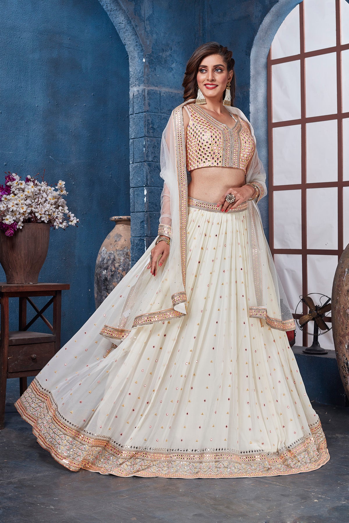 Shop off-white embroidered designer lehenga online in USA with dupatta. Get set for weddings and festive occasions in exclusive designer Anarkali suits, wedding gown, salwar suits, gharara suits, Indowestern dresses from Pure Elegance Indian fashion store in USA.-full view