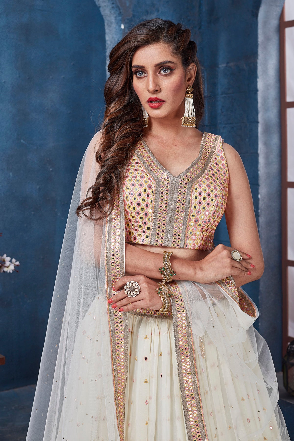 Shop off-white embroidered designer lehenga online in USA with dupatta. Get set for weddings and festive occasions in exclusive designer Anarkali suits, wedding gown, salwar suits, gharara suits, Indowestern dresses from Pure Elegance Indian fashion store in USA.-closeup
