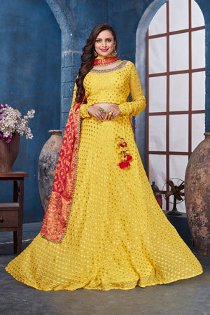 Buy stunning yellow designer lehenga online in USA with red dupatta. Get set for weddings and festive occasions in exclusive designer Anarkali suits, wedding gown, salwar suits, gharara suits, Indowestern dresses from Pure Elegance Indian fashion store in USA.-front