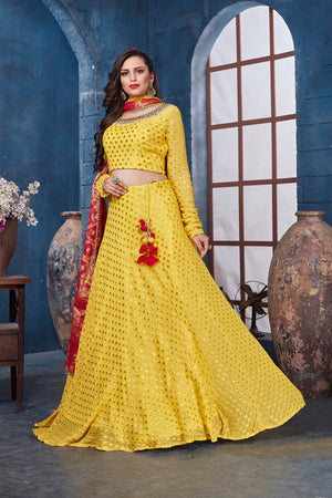 Buy stunning yellow designer lehenga online in USA with red dupatta. Get set for weddings and festive occasions in exclusive designer Anarkali suits, wedding gown, salwar suits, gharara suits, Indowestern dresses from Pure Elegance Indian fashion store in USA.-left