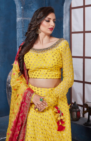 Buy stunning yellow designer lehenga online in USA with red dupatta. Get set for weddings and festive occasions in exclusive designer Anarkali suits, wedding gown, salwar suits, gharara suits, Indowestern dresses from Pure Elegance Indian fashion store in USA.-closeup