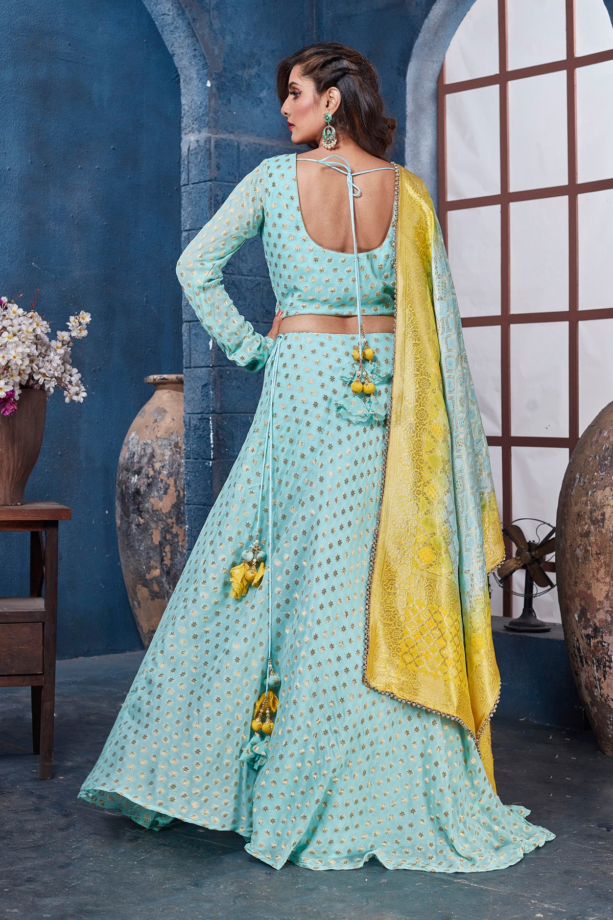 Buy gorgeous light blue embroidered designer lehenga online in USA with yellow dupatta. Get set for weddings and festive occasions in exclusive designer Anarkali suits, wedding gown, salwar suits, gharara suits, Indowestern dresses from Pure Elegance Indian fashion store in USA.-back